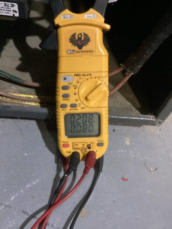 Completed heating maintenance on aging system (10+ years). Performed electrical diagnostic testing using UEi EM152 probe measuring device (reading of 35.5) and UEi PRO: DL379 clamp meter (readings of 208V). All measurements within acceptable parameters, system functioning properly after service.