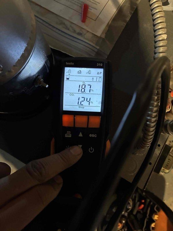 Completed routine heating system tune-up with comprehensive combustion analysis using Testo 310 analyzer, measuring CO2 levels at 18.7% and temperature at 124°. Inspected gas connections, flexible gas line, and associated fittings; all components found to be in serviceable condition with no leaks detected.