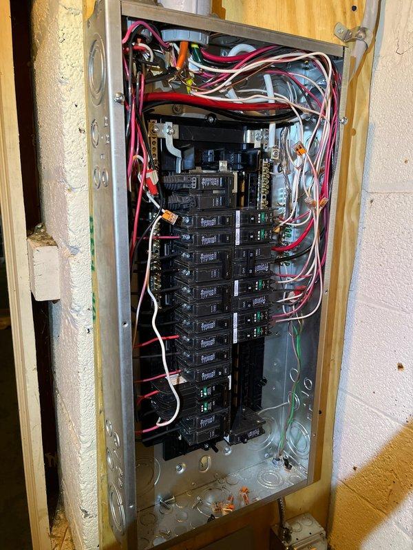 Completed panel replacement and relocation service. Installed new breaker panel with updated wiring configuration, ensuring proper connections for all circuits. All conduits and flexible metallic connections were properly secured and routed according to code requirements.