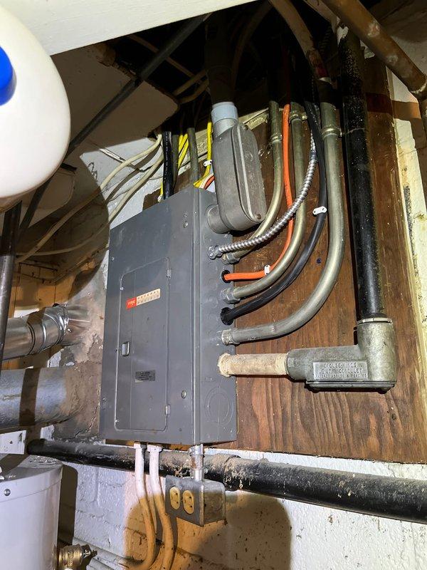 Completed panel replacement and relocation service. Installed new breaker panel with updated wiring configuration, ensuring proper connections for all circuits. All conduits and flexible metallic connections were properly secured and routed according to code requirements.