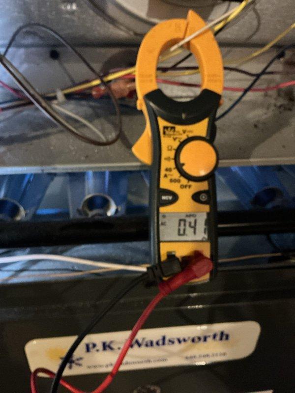 Responded to no heat call for customer's furnace. Upon inspection, performed electrical diagnostics with clamp meter showing low amperage (04) reading. Visual inspection of burner assembly revealed only two operational burner tubes with weak blue flames, indicating gas flow issues. Cleaned flame sensor, checked gas pressure, and adjusted gas valve to restore proper combustion across all burners. System now operating within normal parameters with adequate heat output.
