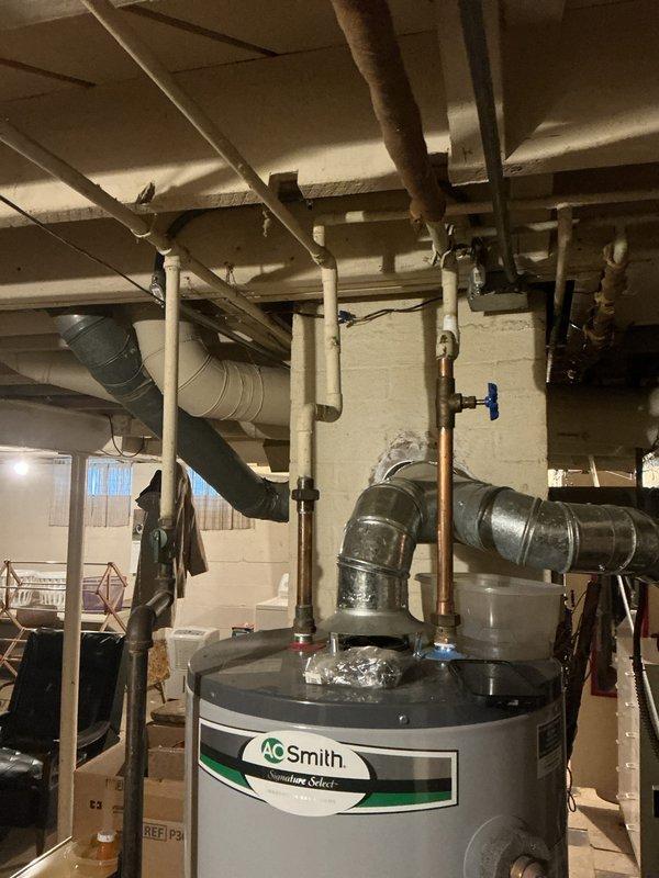 Performed electrical inspection of residential service entrance components. Noted visible corrosion at meter base mounting points where attached to exterior siding. Panel and breakers appear functional despite weathering at connection points.