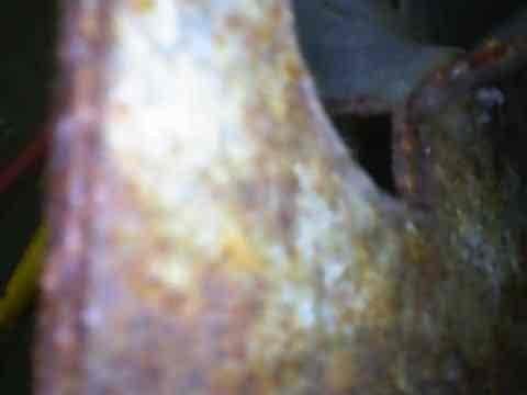 Performed comprehensive heating tune-up on 15-year-old gas furnace located in basement. Inspection revealed significant corrosion and rust accumulation on heat exchanger components and connection points. Cleaned accessible components, tested system operation, and advised customer that equipment is showing age-related deterioration that should be monitored.