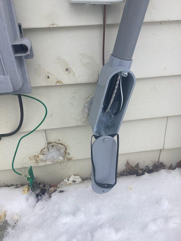 Responded to service call regarding ice formation on interior breaker panel. Upon inspection, discovered improper exterior electrical service entrance installation with open junction box and compromised conduit sealing, allowing moisture penetration into the basement electrical panel. Sealed exterior service entrance components and repaired weatherproofing to prevent further water intrusion and ice formation on interior electrical equipment.