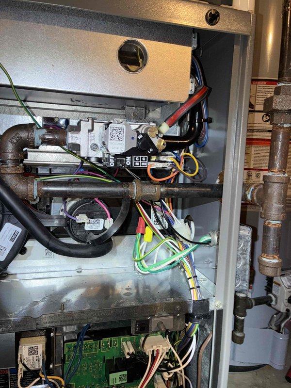 Performed monthly heating maintenance service on the HVAC system. Inspected control module and circuit board connections, verifying proper wiring integrity across all terminal points. All electrical components and connections were found to be in good working order with no signs of wear or damage.