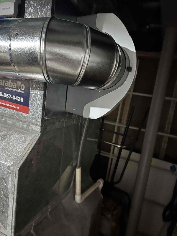 Returned to complete humidifier replacement on existing HVAC system. Installed new unit with digital control panel showing temperature readings, ensuring proper connection to the main ductwork system. Made necessary adjustments to the installation including proper sealing of transition fittings and verification of condensate drainage functionality.