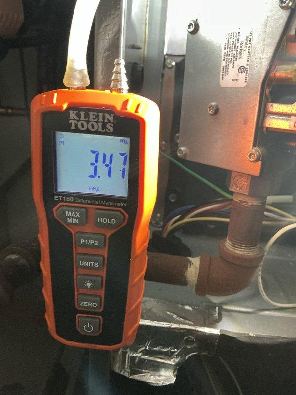 Responded to intermittent no-heat complaint on first floor of residence with 6-9 year old furnace system. Conducted diagnostic testing including gas pressure measurements with manometer (7.47" WC) and electrical control circuit verification with multimeter. System was operational during visit, but performed comprehensive inspection to identify potential causes of intermittent failure for preventative maintenance.