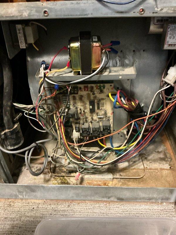 Conducted comprehensive assessment of dual-system HVAC setup for potential furnace replacement in upstairs unit. Inspection revealed aging equipment with notable wear on electrical components and control board. Documented existing humidifier installation and evaluated current ductwork/ventilation system for compatibility with replacement options.