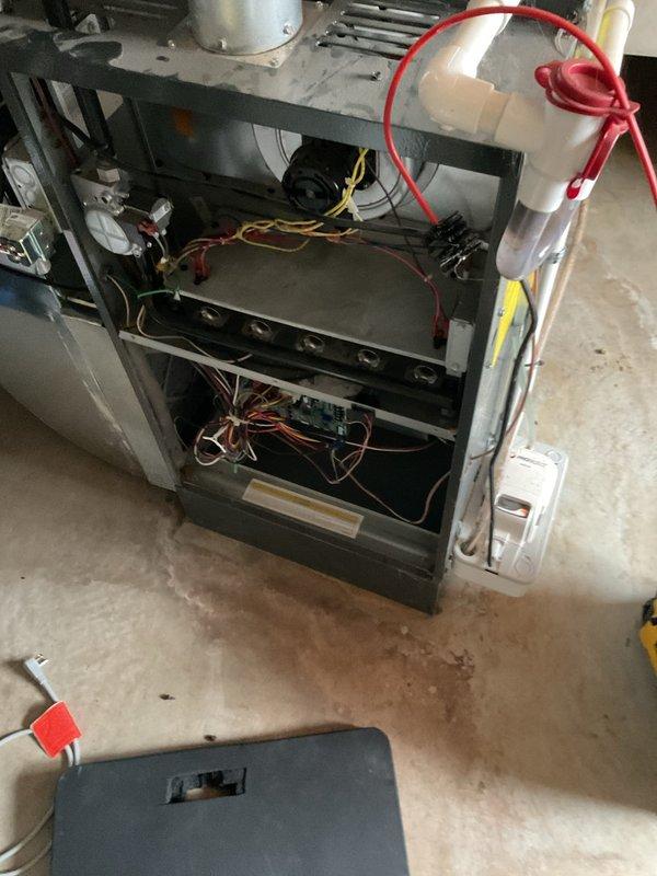 Responded to emergency no-heat call for a 2022 model furnace. Upon inspection, discovered a severely clogged air filter restricting airflow and causing system shutdown. Removed and replaced filter, cleaned connections on control board, and verified proper operation through complete heating cycle.