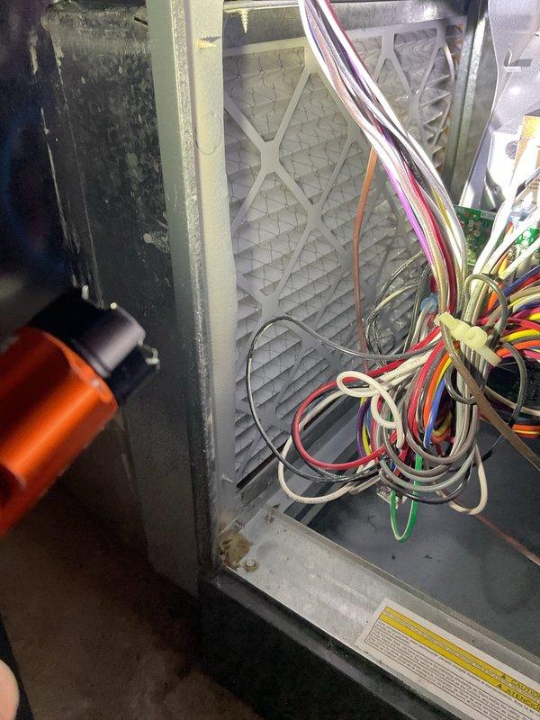 Responded to emergency no-heat call for a 2022 model furnace. Upon inspection, discovered a severely clogged air filter restricting airflow and causing system shutdown. Removed and replaced filter, cleaned connections on control board, and verified proper operation through complete heating cycle.