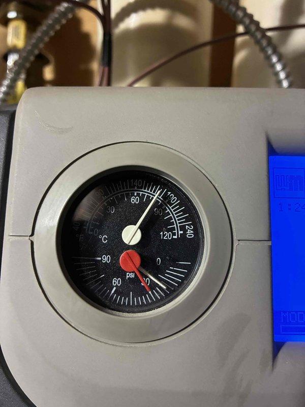 Responded to customer call regarding ceiling leak from boiler. Performed diagnostic inspection and pressure testing. System was operating at normal temperature (60-70°C) but showed low pressure reading near 0 psi. Checked modulation parameters via digital control panel and restored proper system pressure to resolve the leak issue.