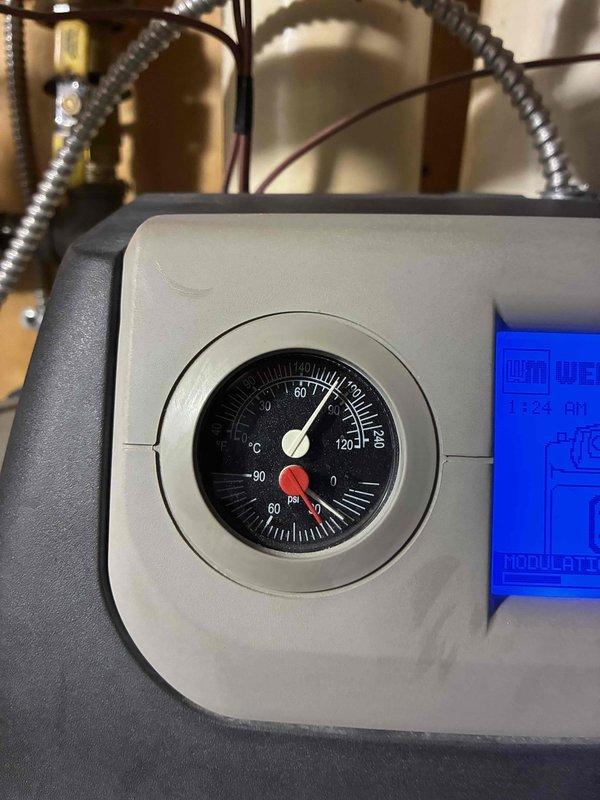 Responded to customer call regarding ceiling leak from boiler. Performed diagnostic inspection and pressure testing. System was operating at normal temperature (60-70°C) but showed low pressure reading near 0 psi. Checked modulation parameters via digital control panel and restored proper system pressure to resolve the leak issue.
