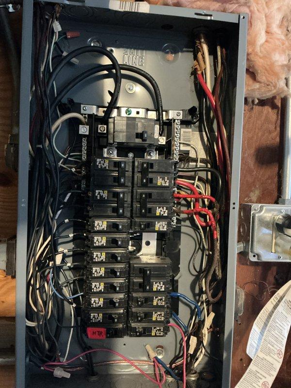 Conducted full electrical inspection of circuit breaker panel, examining all breakers, wiring connections, and load distribution. Panel showed proper organization of line and neutral conductors with "FIRE LINE" designation present. No deficiencies or code violations were identified during the inspection.