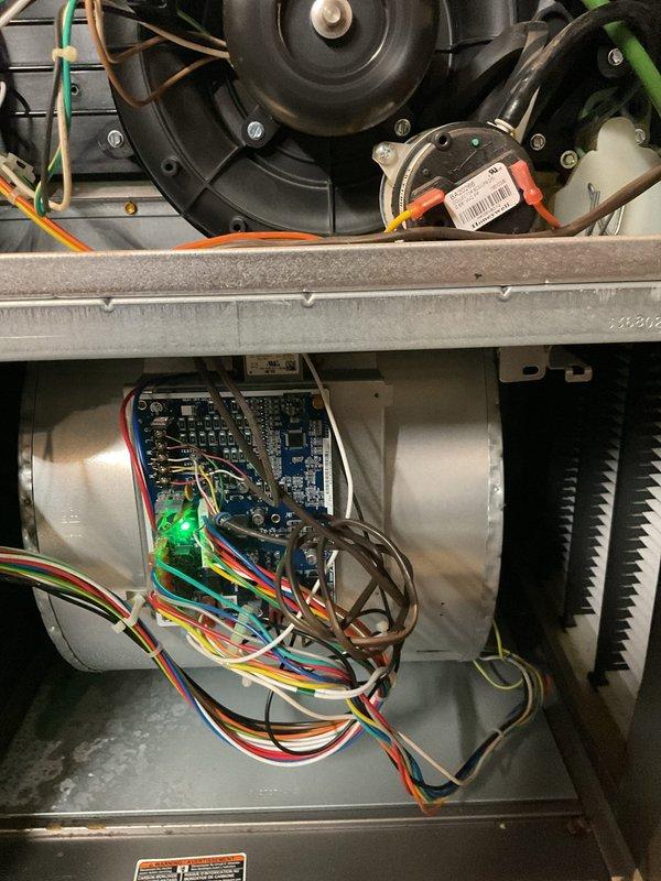 Responded to no-heat emergency call for 7-8 year old gas furnace. Inspection revealed significant dust accumulation on air filter assembly causing restricted airflow. Checked circuit board functionality (confirmed power with illuminated green LED) and examined blower motor assembly. Cleaned filter system, restored proper airflow, and verified furnace operation. System now functioning correctly with appropriate heat output.