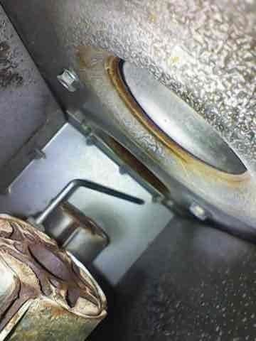 Performed routine heating maintenance on a 10+ year old gas furnace located in basement. Inspection revealed significant rust and corrosion on critical components, with evidence of moisture accumulation at material junctions. System showing advanced age-related deterioration that may affect operational efficiency and safety.