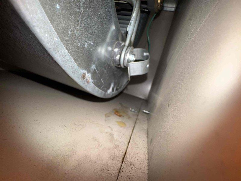 Responded to customer call regarding furnace heating issues. Upon inspection, discovered melted plastic filter causing heat exchange problems. Documented water damage near the unit suggesting possible condensate leak. System was shut down for safety; recommend replacement of damaged components and further assessment of water intrusion source.