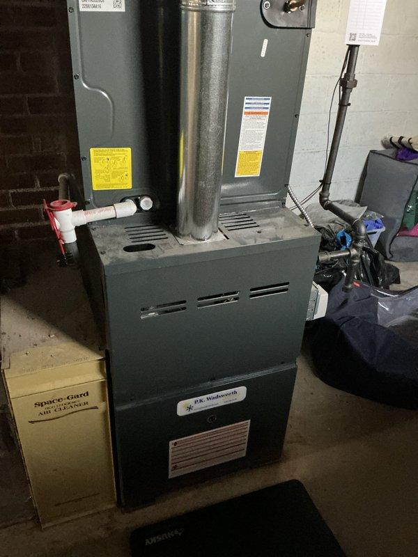 Performed comprehensive HVAC heating tune-up on Dr. Holdsworth furnace system with Space-Gard Air Cleaner attachment. Inspected and replaced air filter, cleaned return air mesh screen, and verified proper exhaust venting through metal flue pipe. System now operating at optimal efficiency with all safety components functioning correctly.