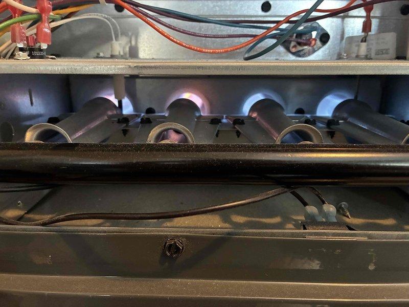 Performed routine heating system maintenance inspection on gas furnace. Checked burner assembly for proper flame pattern and verified electrical connections at control board. System operating normally with no issues identified.