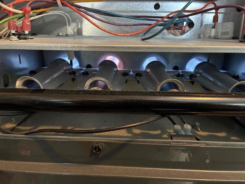 Performed routine heating system maintenance inspection on gas furnace. Checked burner assembly for proper flame pattern and verified electrical connections at control board. System operating normally with no issues identified.