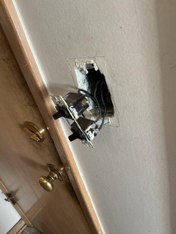 Diagnosed and repaired non-functional hallway ceiling light fixture initially reported as potential burnt bulb issue. Inspection revealed faulty wiring connection at switch location which was causing fixture failure despite multiple bulb replacement attempts. Restored proper electrical connectivity and verified full functionality of the 9-light ceiling fixture.