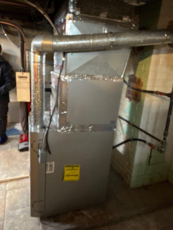 Conducted comprehensive assessment of 24-year-old furnace system with 2019 AC unit. Customer has existing quote from Lang. Visual inspection revealed Carrier unit with purple filter installed and extensive ductwork wrapped in reflective insulation. Provided replacement options for aging furnace while maintaining relatively new AC component.