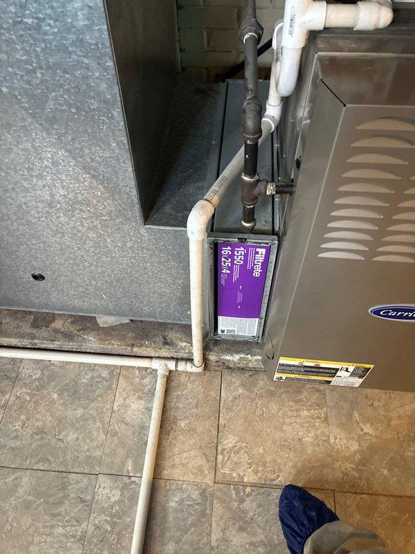 Conducted comprehensive assessment of 24-year-old furnace system with 2019 AC unit. Customer has existing quote from Lang. Visual inspection revealed Carrier unit with purple filter installed and extensive ductwork wrapped in reflective insulation. Provided replacement options for aging furnace while maintaining relatively new AC component.