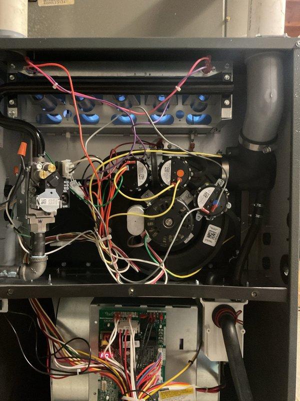 Responded to warranty call for intermittent heating issue where furnace was only reaching 66°F despite thermostat setting of 74°F. Performed diagnostic inspection of internal components, including circuit board connections and blower motor assembly. Identified and corrected faulty wiring connections at control board that were causing system to periodically default to fan-only operation instead of heating cycle.