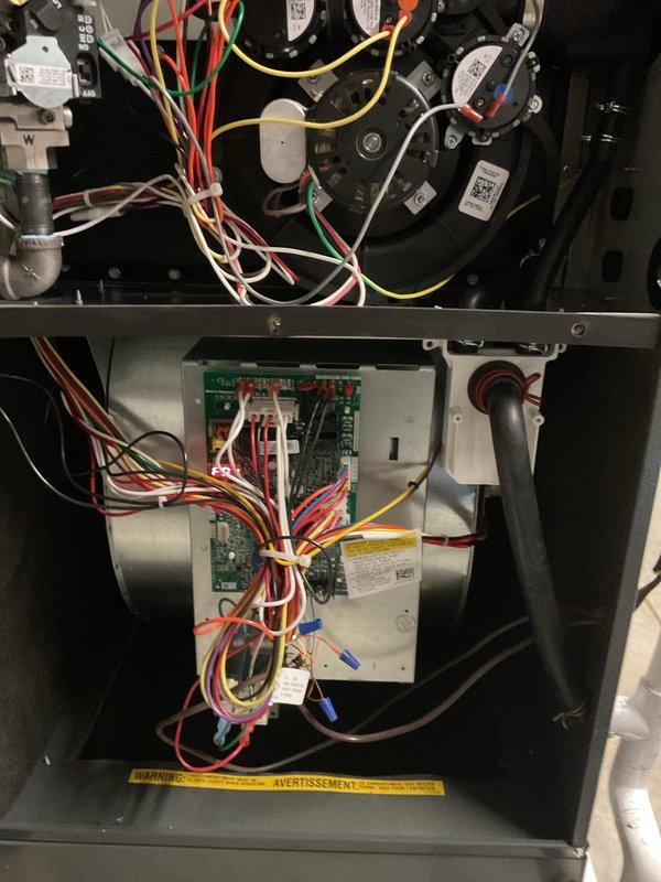 Responded to warranty call for intermittent heating issue where furnace was only reaching 66°F despite thermostat setting of 74°F. Performed diagnostic inspection of internal components, including circuit board connections and blower motor assembly. Identified and corrected faulty wiring connections at control board that were causing system to periodically default to fan-only operation instead of heating cycle.