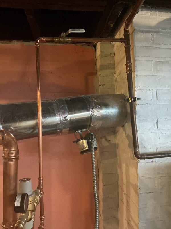 Responded to no-heat complaint where customer reported boiler buzzing followed by heat failure. Upon inspection of the heating system components in utility area, found issue with boiler ignition sequence. Diagnosed and repaired faulty control valve, restoring proper operation and heat output to the residence.