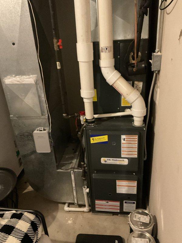 Conducted maintenance service on two heating systems, inspecting furnace units with associated ventilation components. Both systems were found to be in good working condition with proper PVC venting configurations and ductwork connections. No issues were identified during the recurring monthly service visit.
