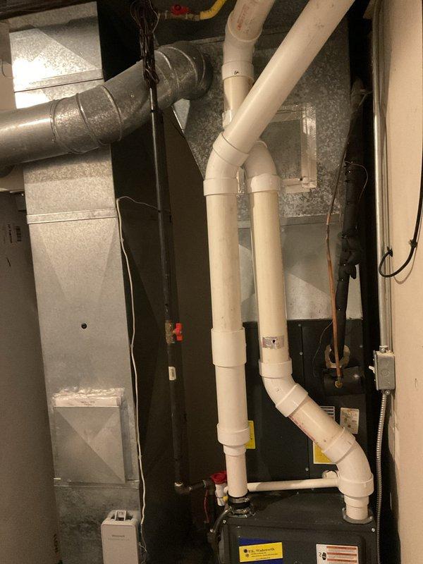 Conducted maintenance service on two heating systems, inspecting furnace units with associated ventilation components. Both systems were found to be in good working condition with proper PVC venting configurations and ductwork connections. No issues were identified during the recurring monthly service visit.