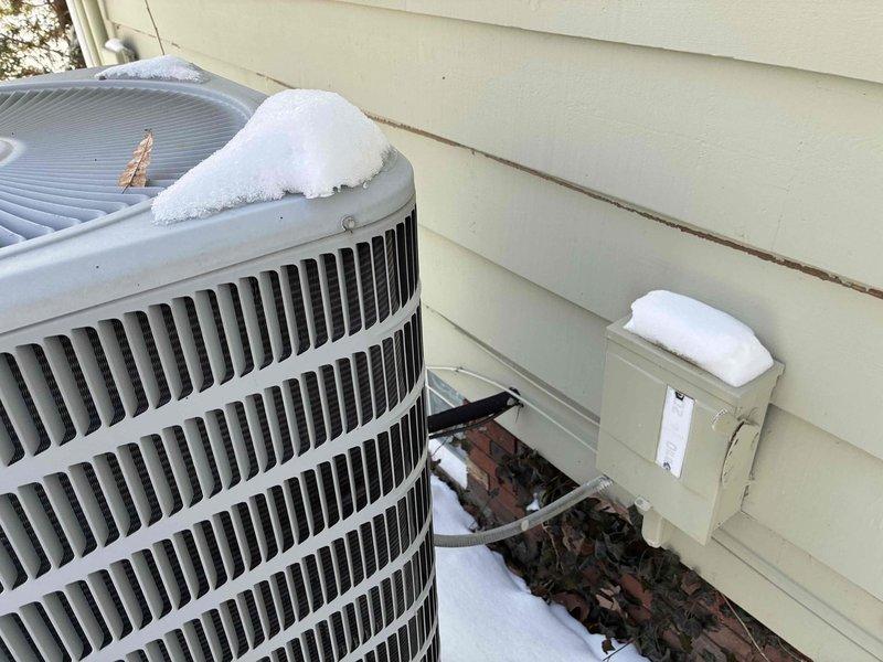 Performed assessment of existing heat pump system (model 4HP13L36P-7A, S/N 1913A02382) containing R-410A refrigerant. Unit is functional but aging, with outdoor condenser showing normal weathering and snow accumulation on top. Provided customer with replacement options for consideration.