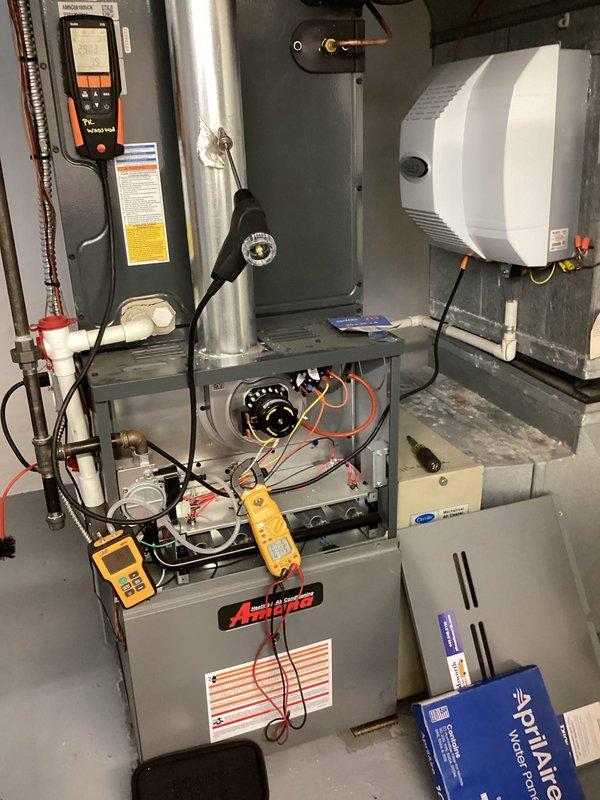 Performed routine heating maintenance on Amana furnace system. Conducted electrical diagnostics using UEi G2 Phoenix multimeter, measuring voltage parameters at 0.250/0.082. Replaced furnace filter and addressed humidifier warning light by inspecting Aprilaire water panel that required replacement.