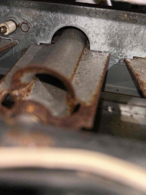 Diagnosed no heat complaint on aging system. Inspection revealed severe rust and corrosion on heat exchanger components, indicating end-of-life deterioration. Recommended system replacement due to safety concerns and uneconomical repair options for the 10+ year old unit.
