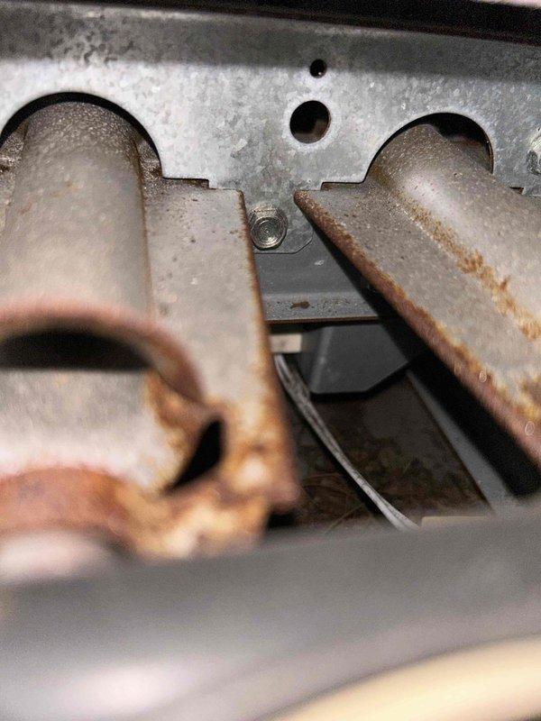 Diagnosed no heat complaint on aging system. Inspection revealed severe rust and corrosion on heat exchanger components, indicating end-of-life deterioration. Recommended system replacement due to safety concerns and uneconomical repair options for the 10+ year old unit.