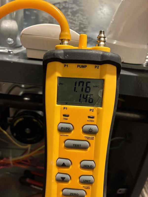 Completed installation of 80% efficiency furnace with humidifier and liner. Performed pressure testing with digital manometer, confirming proper static pressure readings of 1.76 and 1.46 inWC, verifying system is operating within manufacturer specifications.