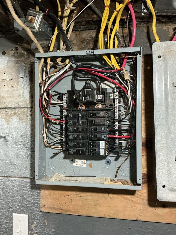 Inspected customer's electrical panel to diagnose recurring circuit breaker trip issue. Identified an overloaded circuit serving a window AC unit in an upstairs room. Advised customer on proper load distribution and provided quotes for relocating several outlets to prevent future overloads.