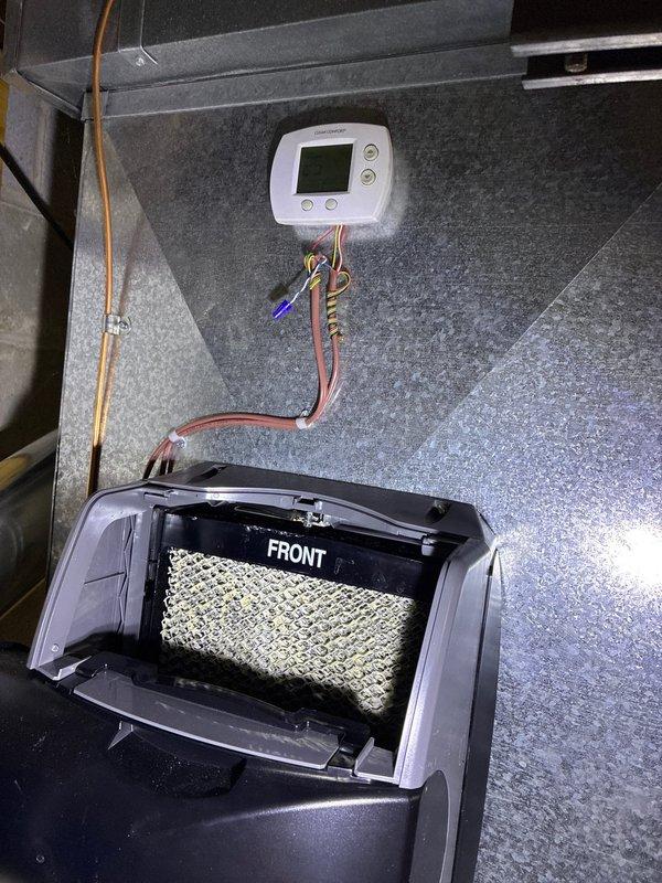 Performed assessment for heat pump system replacement on a residential property with 4 existing heat pump systems. Inspected current installation which showed two Amana units with significant snow accumulation. Evaluated existing control systems including thermostat connections and humidifier components. Customer is a returning client with two previous projects completed.