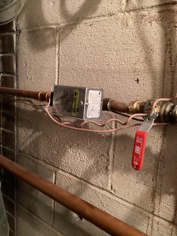 Responded to emergency no-heat call and discovered air lock in hydronic heating system. Purged air from the system using manual air vents on copper distribution lines, allowing proper circulation to resume. System now operating normally with heat restored to residence.