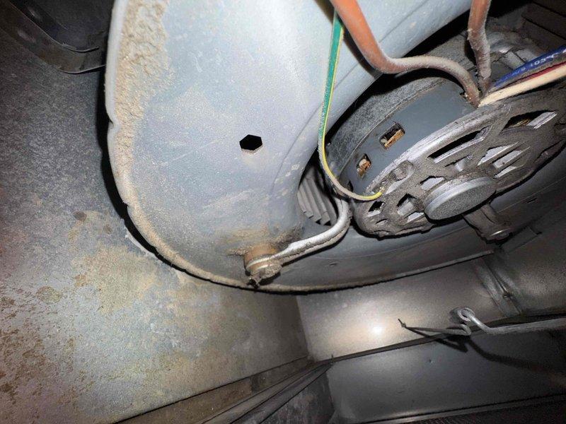 Responded to no-heat service call for aging furnace with reported squealing noise. Upon inspection, found blower motor had seized due to bearing failure as evidenced by wear patterns and inability to rotate freely. Replaced blower motor assembly, lubricated bearings, and verified proper operation through complete heating cycle test.