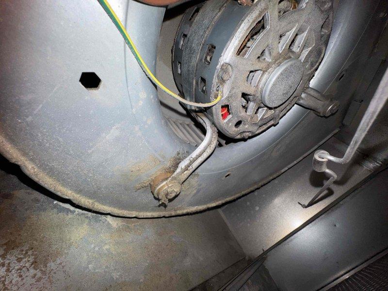 Responded to no-heat service call for aging furnace with reported squealing noise. Upon inspection, found blower motor had seized due to bearing failure as evidenced by wear patterns and inability to rotate freely. Replaced blower motor assembly, lubricated bearings, and verified proper operation through complete heating cycle test.