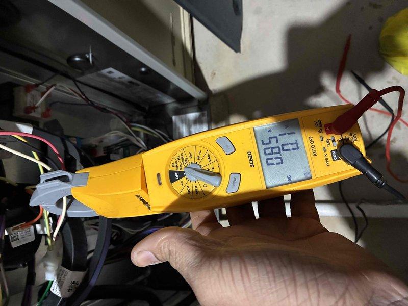 Performed routine heating maintenance service on system. Conducted electrical testing with multimeter to verify proper voltage readings (measured 65V) at control board. Inspected blower motor assembly and wiring connections, confirming all components were properly secured and operational.