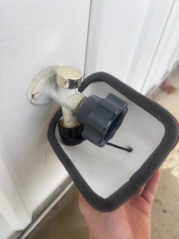 Completed rebuilding of two exterior water spigots with new components. Installed protective insulation covers to prevent freezing and added drip containment systems to capture any potential leakage. Both units now functioning properly with no leaks observed.