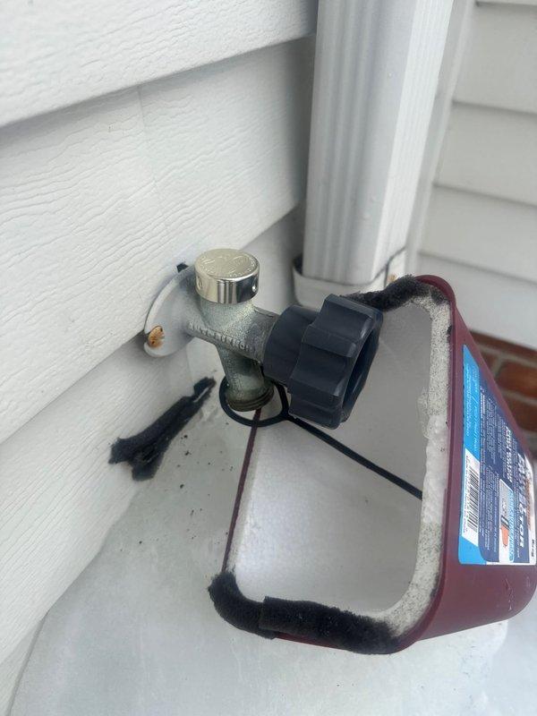 Completed rebuilding of two exterior water spigots with new components. Installed protective insulation covers to prevent freezing and added drip containment systems to capture any potential leakage. Both units now functioning properly with no leaks observed.