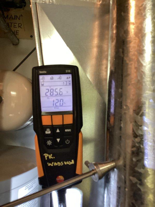 Performed routine furnace maintenance including combustion analysis with Testo 310 meter showing CO2 readings of 28.56 and O2 readings of 1.20. Completed diagnostic testing on the gas furnace system with access panel open to inspect control board and internal components, ensuring proper operation for the heating season.