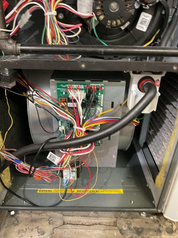 Completed routine heating maintenance on Amana furnace system. Inspected circuit board, wiring connections, and blower assembly for proper function. Examined PVC intake/exhaust piping and verified all components operating correctly.