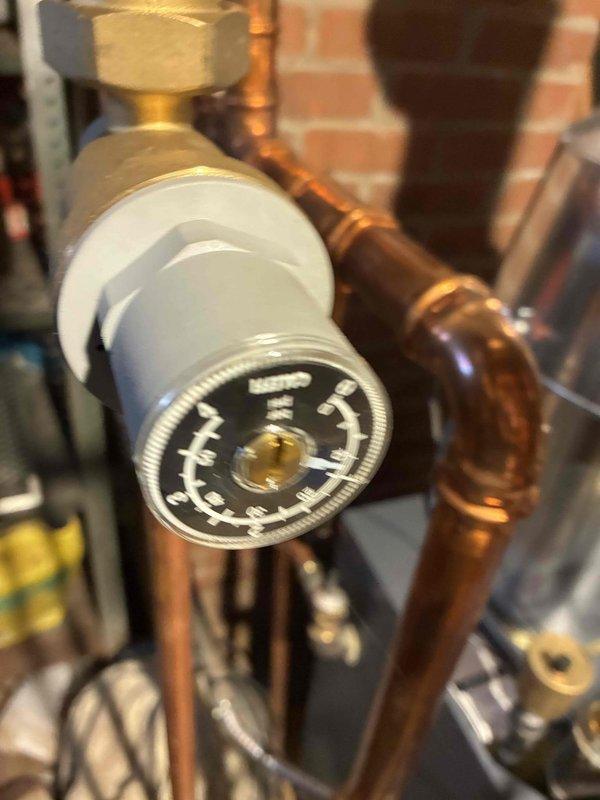 Performed routine heating system maintenance on boiler system. Inspected pressure gauge readings and examined copper piping connections for proper operation. All components were found in good working condition with no visible leaks or corrosion.