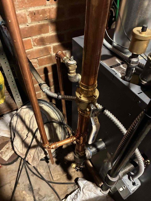 Performed routine heating system maintenance on boiler system. Inspected pressure gauge readings and examined copper piping connections for proper operation. All components were found in good working condition with no visible leaks or corrosion.