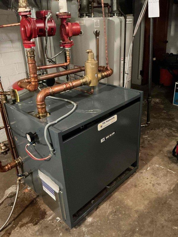 Performed scheduled maintenance on hydronic boiler system. Inspected copper piping network, verified proper operation of circulator pumps, and checked all brass valves and fittings. System is functioning within normal parameters.