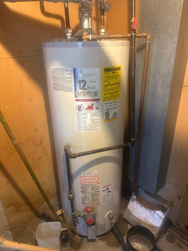 Performed scheduled maintenance on standard tank-type water heater. Inspected all plumbing connections, checked temperature and pressure relief valve, and verified proper venting. Unit appears to be in normal working condition with no signs of leaks or deterioration.